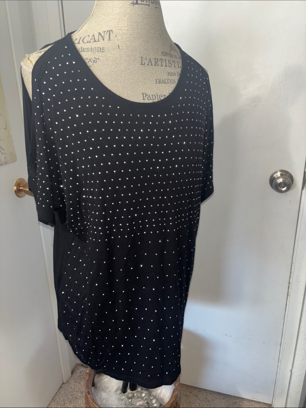 U-knit black cold-shoulder Top embellished with small silver studs.